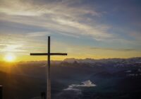 brown cross on mountain