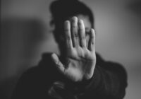 close-up photography of person lifting hands