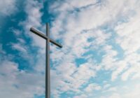 landscape shot of white cross during daytime