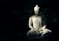 white Buddha statue on body of water