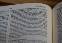 white book page on brown wooden table