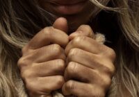 woman with hands tied