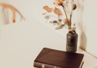 black hardbound book on white table