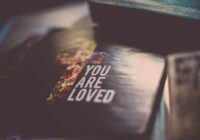 selective focus photography of You Are Loved book
