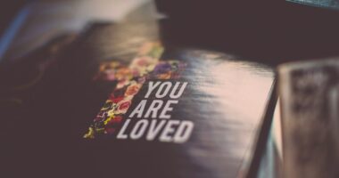 selective focus photography of You Are Loved book